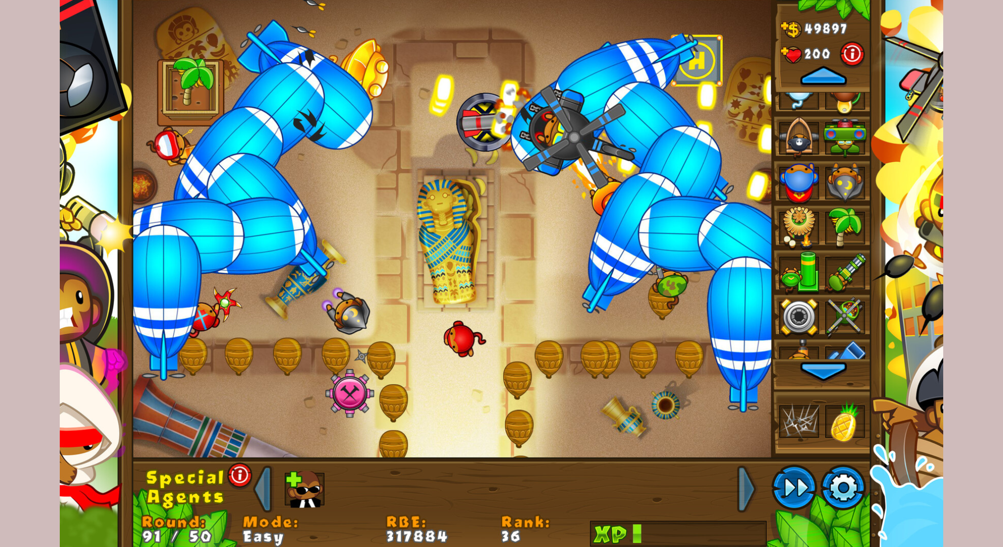 Bloons Tower Defense 5 screenshot showing a map with the splash screen down the side and MOABs.