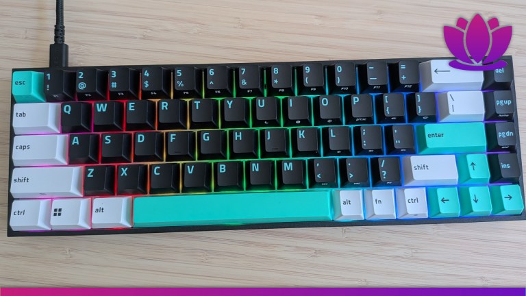 Image of a black, blue, and white keyboard with RGB lights.